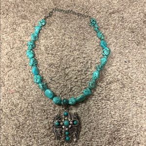 Silver and turquoise cross with wings necklace
